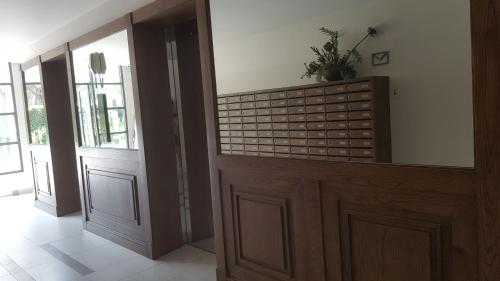 a room with a door with a potted plant on top at The Rain Cha Am by Paka in Cha Am
