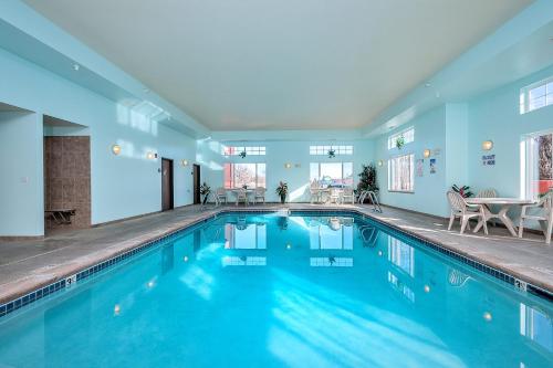 a swimming pool with blue water in a house at Days Inn by Wyndham Manitou Springs in Manitou Springs