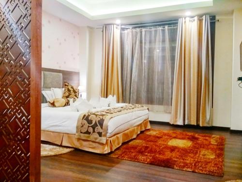 Ένα ή περισσότερα κρεβάτια σε δωμάτιο στο Pearl Retreat