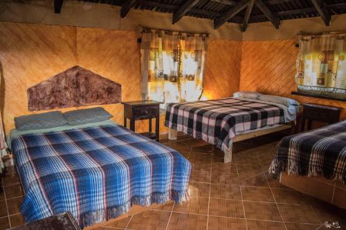 Ein Bett oder Betten in einem Zimmer der Unterkunft Cabañas los Cedros