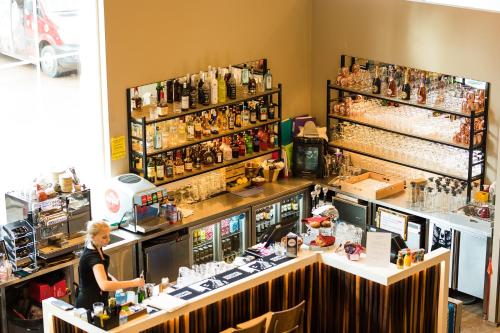 a woman standing at a counter in a bar at Santa Claus Holiday Village in Rovaniemi