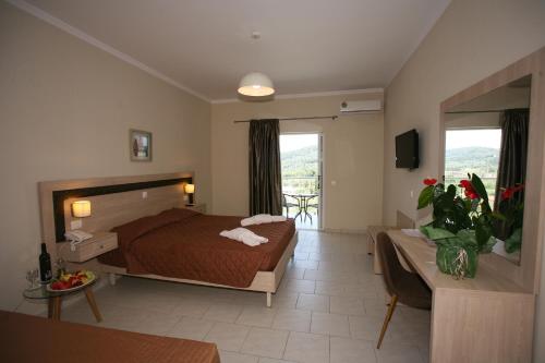 A bed or beds in a room at Saint George Palace