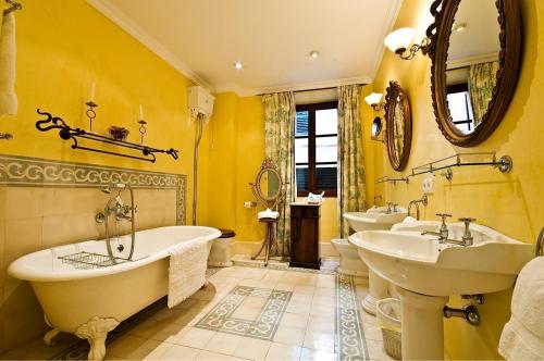 a bathroom with two sinks and two bath tubs at The Salvia - Adults Only in Sóller