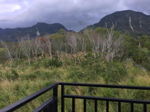 a view of the mountains from a balcony at Lanshan House in Donghe
