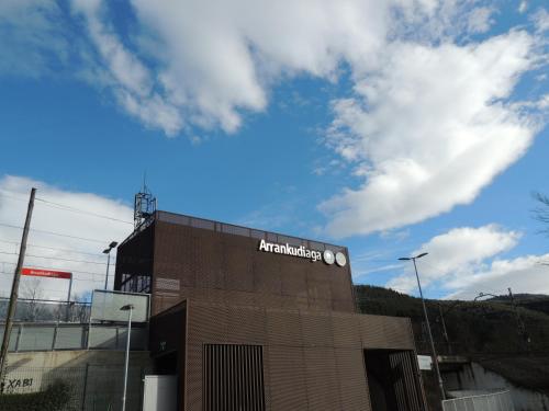 a building with an amazon sign on the side of it at Garai Etxea, casa adosada en la montaña in Arrankudiaga