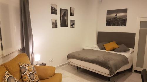 Posteľ alebo postele v izbe v ubytovaní Alcazaba Home City Centre