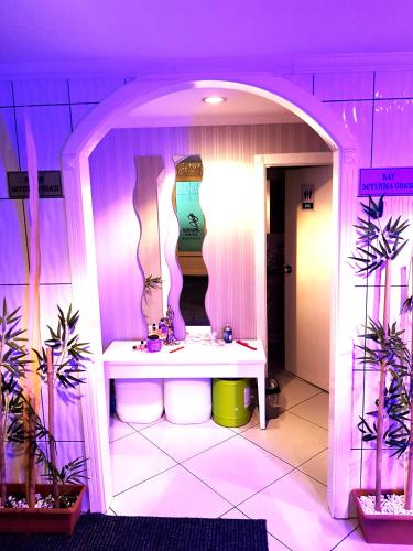a pink bathroom with a sink in a room at Business Park Hotel in Ankara