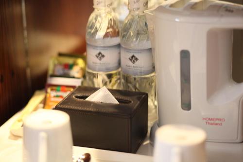 a counter top with a blender and bottles of water at Elite Central Hotel Hanoi in Hanoi
