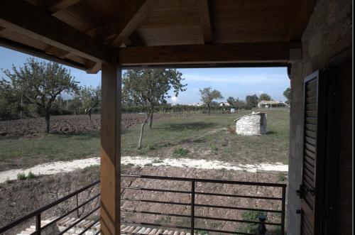 a view of a field from the porch of a house at Agriturismo Il Parco in Nusco