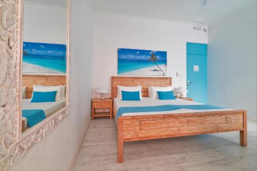 Postel nebo postele na pokoji v ubytování Villa Rosa Maldives