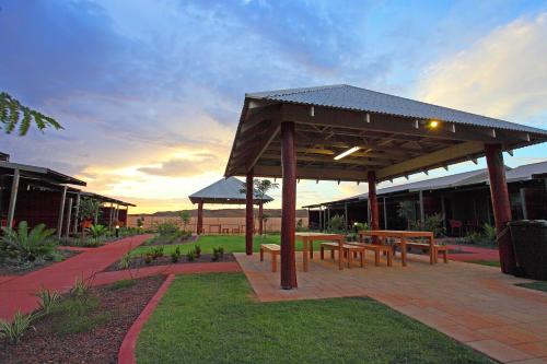 a pavilion with benches and tables on a patio at Best Western Plus The Ranges Karratha in Karratha
