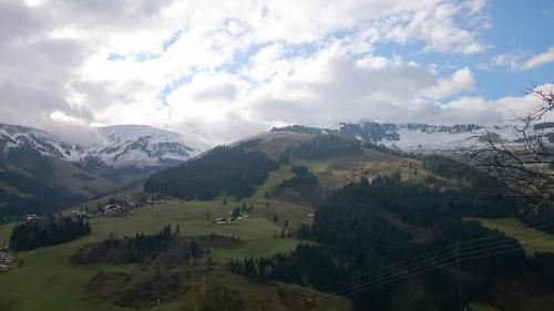 a view of a mountain range with snow covered mountains at Ferienwohnung Klappacher in Maria Alm am Steinernen Meer