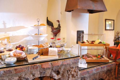 a buffet with many different types of food on a table at DER SCHWAN Hotel & Restaurant in Schwanstetten