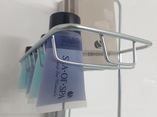a toothbrush holder with a toothbrush at אבני החושן- Avnei Hoshen in Nahariyya
