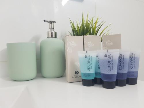 a group of four products sitting on a counter at אבני החושן- Avnei Hoshen in Nahariyya
