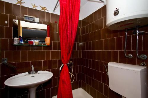 Koupelna v ubytování Apartments Maestro