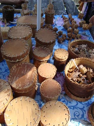 a table topped with cakes and baskets of food at Kuremäe Hostel in Kuremäe
