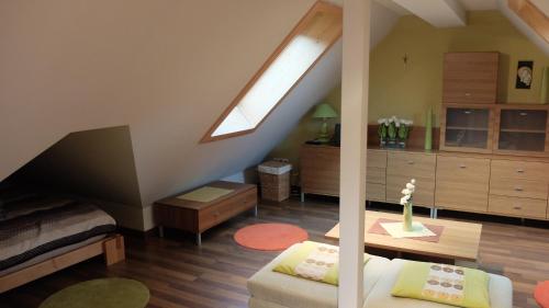 a living room with a skylight in a attic at Apartament Parkowa Polana in Polanica-Zdrój