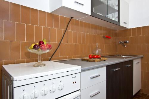 Kuchyň nebo kuchyňský kout v ubytování Apartments Maestro