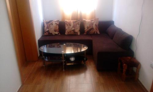 a living room with a couch and a table at Guesthouse Soče in Međugorje