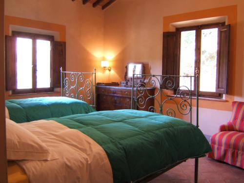 Säng eller sängar i ett rum på Villa Granchiaia