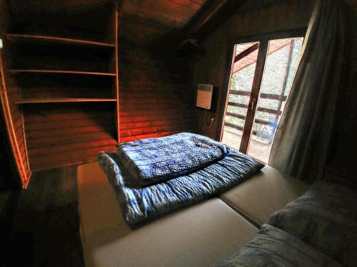 a living room with a couch and a window at Chata ZEBRA in Ružomberok
