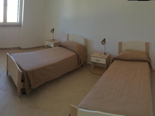A bed or beds in a room at Dimora salentina