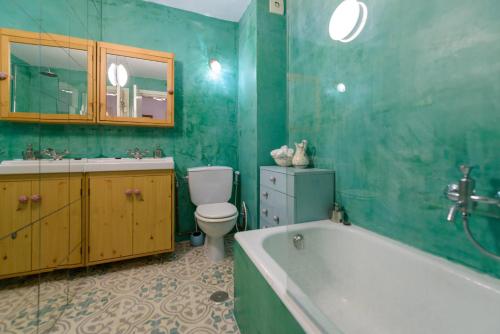 a bathroom with a tub and a toilet and a sink at Central Almuñecar, Beach Playa 125 metres, by Old Town in Almuñécar