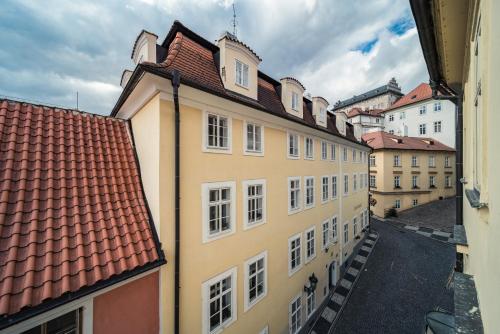 a group of buildings with red roofs at St. George Apartments in Prague