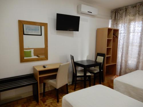 Postel nebo postele na pokoji v ubytování Guesthouse Coimbra City