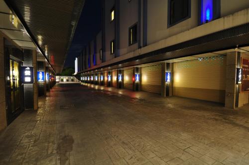 an empty hallway of a building at night at Noble Motel in Taitung City
