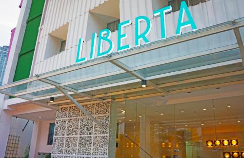 a store front of a library with a sign on it at Liberta Hotel Kemang in Jakarta