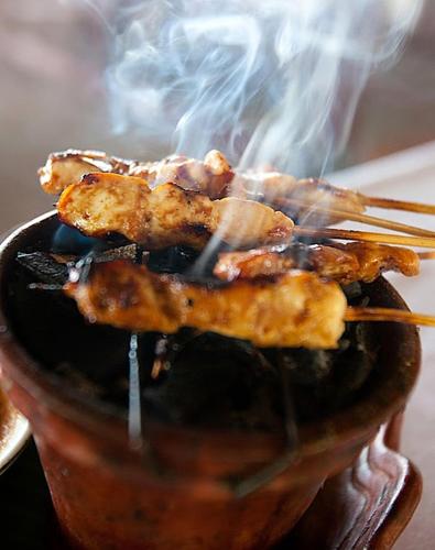 a group of food on sticks in a pot at Imaj Private Villas in Senggigi 