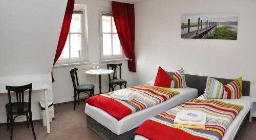 
Ein Bett oder Betten in einem Zimmer der Unterkunft Hotel Am Park

