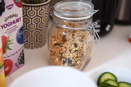 a jar of granola on a counter next to a box at Västerhöjdsgården in Skövde