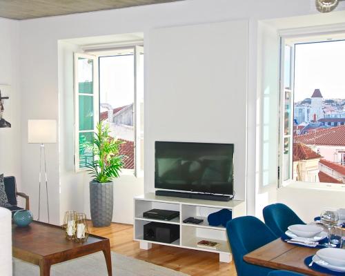 A television and/or entertainment center at Chiado Luxury Apartment