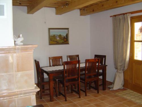 a dining room with a table and chairs at Ferien im Naturschutzgebiet in Kékkút