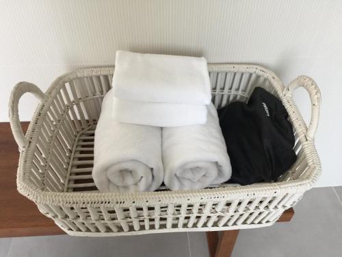 a basket filled with towels on a table at BC Summer Beach in Pran Buri