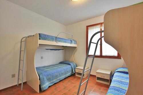 Giường trong phòng chung tại Villa Cellini