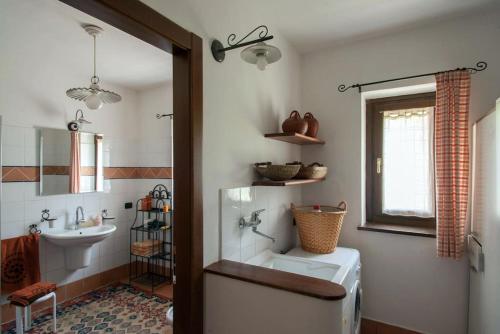 a bathroom with a toilet and a sink at Casa vacanze Il Noce in Sovere