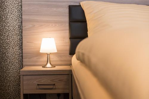 Letto o letti in una camera di Barok Hotel and Apartments