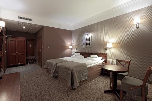 Кровать или кровати в номере Hotel Esperanto