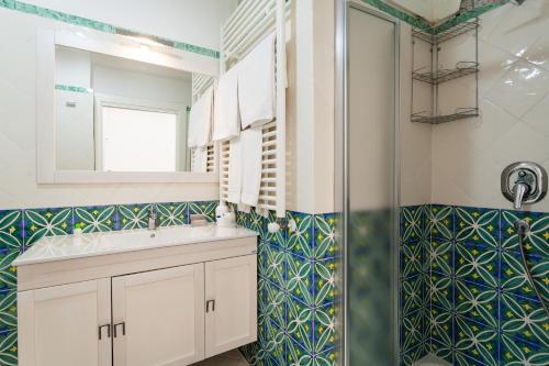 a bathroom with a sink and a shower at Matilde Home in Sorrento