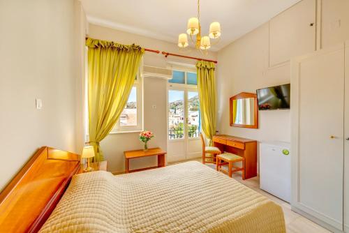 Ένα ή περισσότερα κρεβάτια σε δωμάτιο στο Hotel Halaris