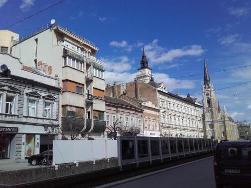 a row of buildings on a city street at Apartment Dunja NS in Novi Sad