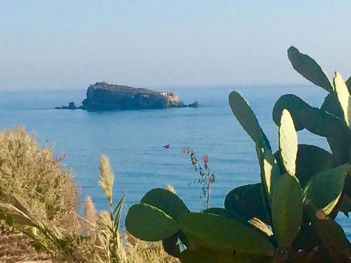 a view of the ocean with a rock in the water at B&B La Veranda in Licata