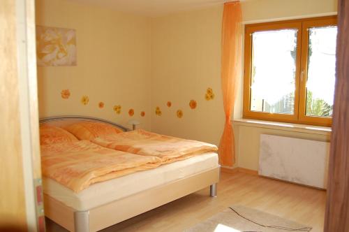 Katil atau katil-katil dalam bilik di Ferienwohnung Grosso