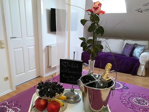 a living room with a table with fruit and a sign at WohlFühlPlatz´l in Stegersbach