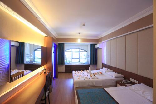 Ένα ή περισσότερα κρεβάτια σε δωμάτιο στο Tac Premier Hotel & Spa