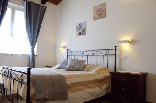 En eller flere senge i et værelse på Il Girasole